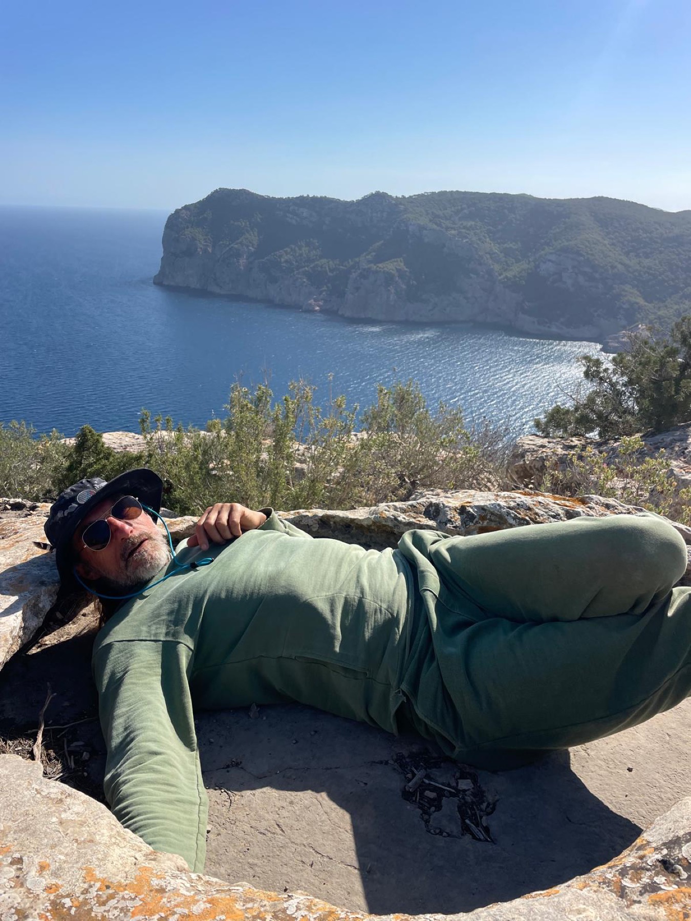 Nick Good resting beside the sea
